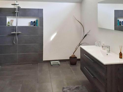 a bathroom with a shower and a sink at Holiday home Taastrup in Tåstrup