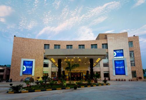 a building with blue signs on the side of it at Velvet Clarks Exotica in Chandīgarh