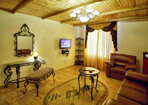 a living room with a couch and a table at Едем in Skhidnitsa