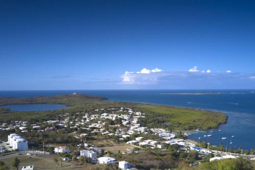 an aerial view of a city and the ocean at Happy Days Villa C in Fajardo