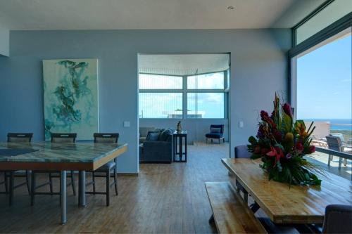 a living room with a table and a couch at Happy Days Villa C in Fajardo