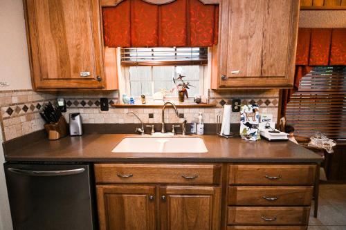a kitchen counter with a sink and a window at Comfortable, Convenient, Great Value in Mobile