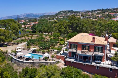 an aerial view of a house with a pool at Avra Private Suites in Lassi