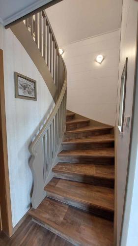 a staircase in a home with wooden floors at Ferienhaus am großen Waldstein in Zell im Fichtelgebirge