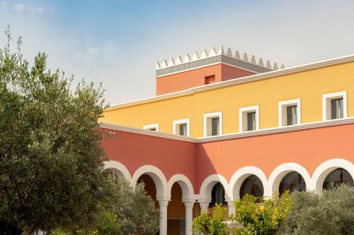 a building with a tower on top of it at Palacio de Sancti Petri, a Gran Meliá - The Leading Hotels of the World in Chiclana de la Frontera