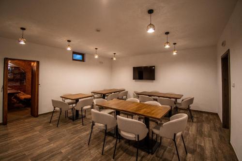 a conference room with wooden tables and chairs at Pension Libá in Libá