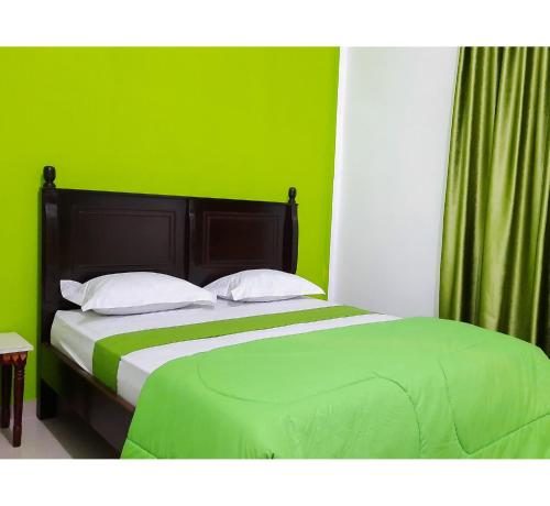 Postel nebo postele na pokoji v ubytování Hotel Berkah Atrama Syariah RedPartner