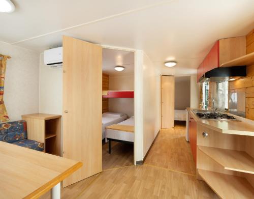 Postel nebo postele na pokoji v ubytování Camping Classe Village