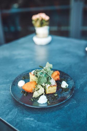 a plate of food on a blue table at Schlosshotel Brilon-Wald in Brilon-Wald