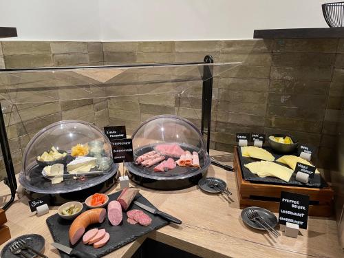 a buffet with different types of food on a table at Schlosshotel Brilon-Wald in Brilon-Wald