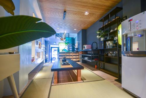 a room with a table in the middle of a room at Min-sheng Art homestay in Tainan