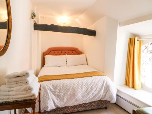 Voodi või voodid majutusasutuse Arch Cottage toas