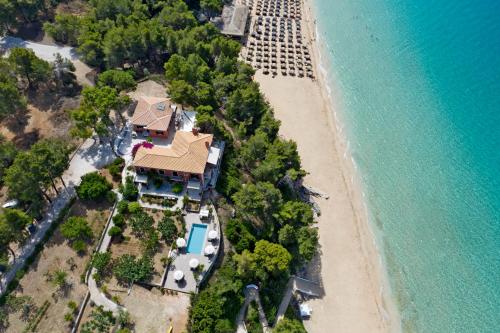 an aerial view of a house on the beach at Avra Private Suites in Lassi