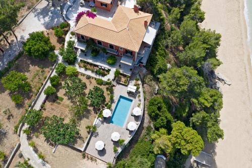an aerial view of a house with a swimming pool at Avra Private Suites in Lassi