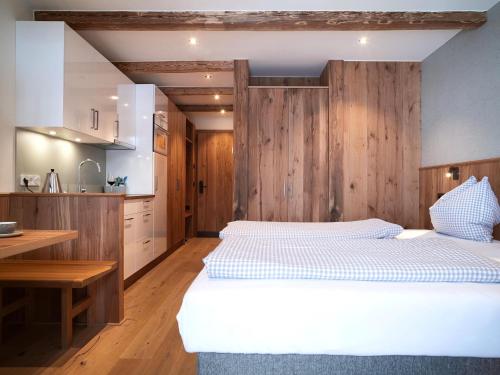 Postel nebo postele na pokoji v ubytování Superb Apartment in Schröcken with Sauna and Pool