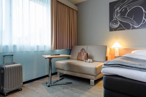 Ένα ή περισσότερα κρεβάτια σε δωμάτιο στο ibis Hamburg Alsterring