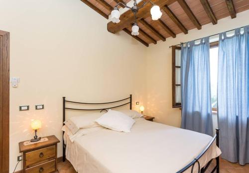 En eller flere senge i et værelse på Agriturismo privato "La Casa Del Sole"