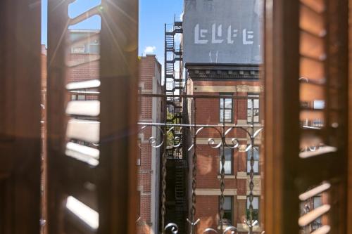 a view from a window of a city at The Historic Blue Moon Hotel - NYC in New York