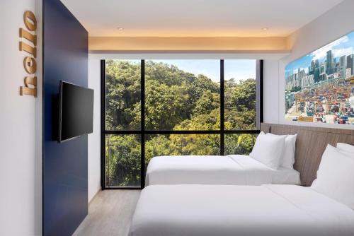 a hotel room with a view of the ocean at Travelodge Harbourfront Singapore (SG Clean) in Singapore