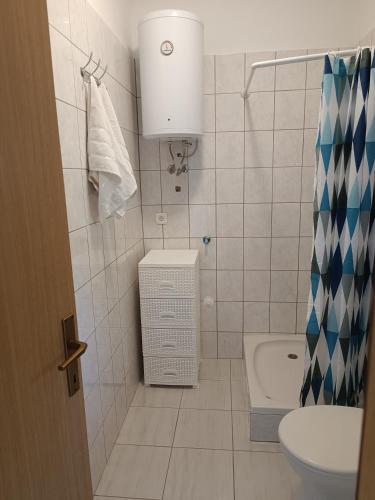 a bathroom with a toilet and a sink at Valentino in Senj