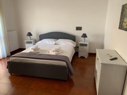 a bedroom with a large bed with two night stands at la dimora di Enea in Lecce