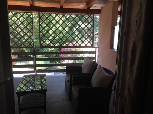 a room with a window with chairs and a table at ANGELO in Koper