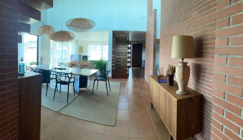 a kitchen and dining room with a brick wall at Villa Monasterio in Camargo