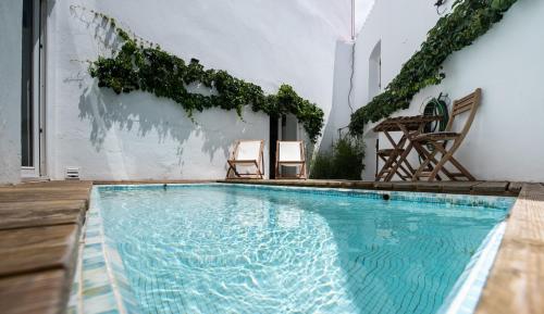 a swimming pool in the middle of a house at Casa D`Arronches in Arronches