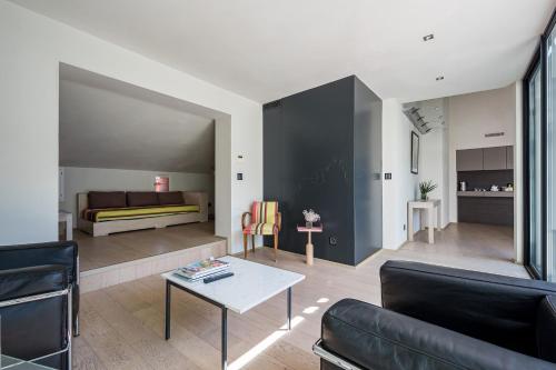 Кровать или кровати в номере La Loge de mer, Lodge urbain