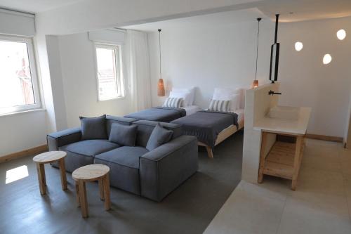 a living room with a couch and a bed at Kalkan Han Hotel in Kalkan
