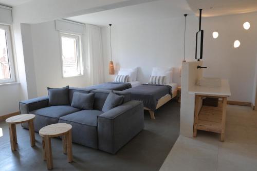 a living room with a couch and a bed at Kalkan Han Hotel in Kalkan