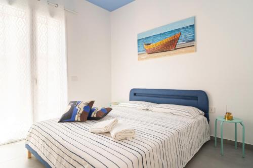 Ένα ή περισσότερα κρεβάτια σε δωμάτιο στο Imama' apartament vista mare