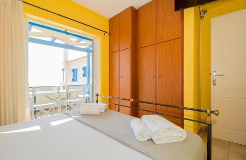 A bed or beds in a room at Laconian Collection ''Le Bleu Infini''