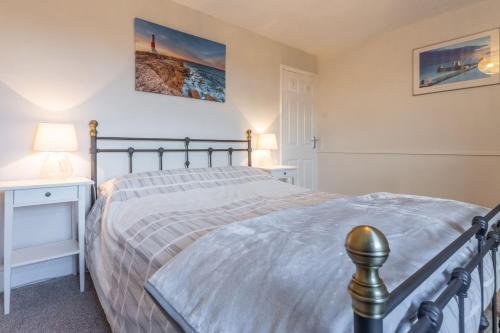 Katil atau katil-katil dalam bilik di Hideaway Cottage