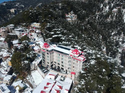 an aerial view of a building on a mountain at WelcomHeritage Elysium Resort & Spa in Shimla