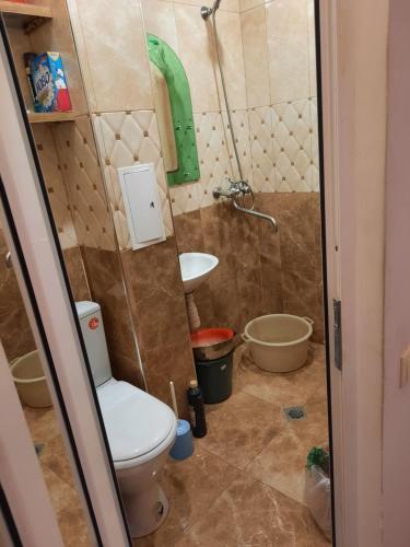 a bathroom with a toilet and a sink at Квартира одна-комнатная in Yerevan