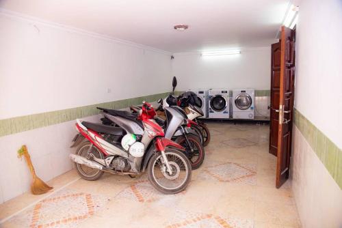 a group of motorcycles parked in a garage at Eden Westlake Hotel in Hanoi