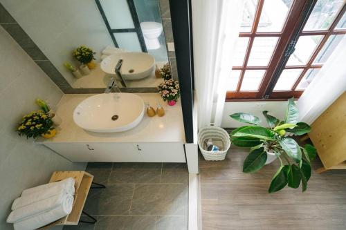 an overhead view of a bathroom with a sink at Eden Westlake Hotel in Hanoi