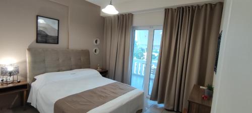 Katil atau katil-katil dalam bilik di Alexandra's Glifa Apartments