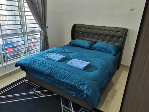 Postel nebo postele na pokoji v ubytování Abah StayCation