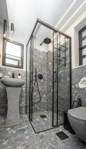 a bathroom with a shower and a sink at Urban Cosy Minimal Nest in Chalkida
