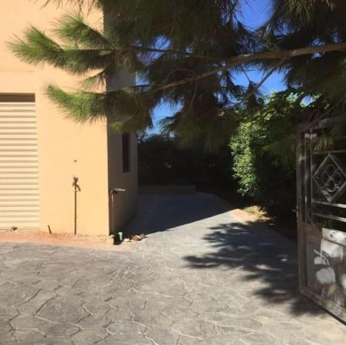 a driveway leading to a house with a garage at The Guesthouse South Lebanon - privacy & luxury 