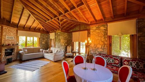 a living room with a table and chairs at THE SIGN Şile Hotel & Spa in Istanbul