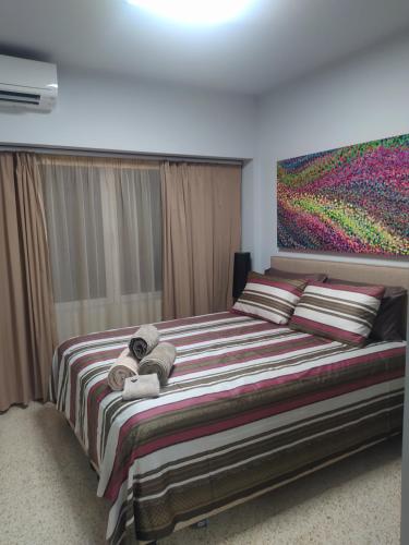 Postel nebo postele na pokoji v ubytování Praxitelous CityCenter Modern Apartments by Aesthetic Living