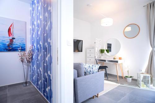 a living room with a chair and a table at NEW! ReLux - ZF Hvar in Hvar