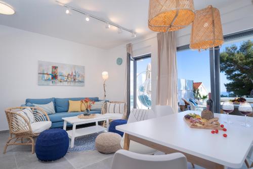 a living room with a couch and a table at NEW! ReLux - ZF Hvar in Hvar
