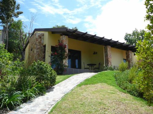 a house with a walkway in front of it at Double Dutch B & B in Knysna