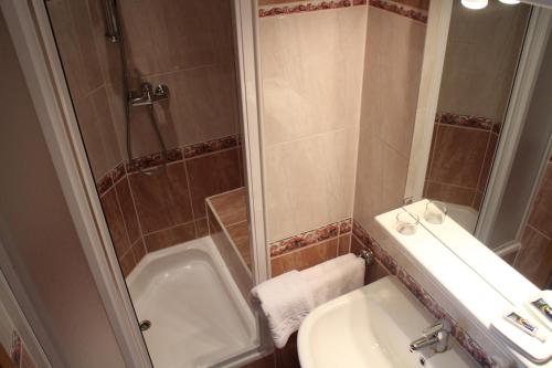 a bathroom with a sink and a toilet and a shower at Pension Janka Kdyně in Kdyně