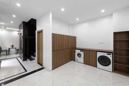 a laundry room with a washer and dryer in it at Ami House 1 in Hanoi