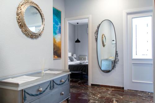 a bathroom with a blue dresser and a mirror at City Center in Granada